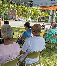 Janice Pankey, president of The Charmettes Inc., speaks at the 52nd anniversary commemorative service.