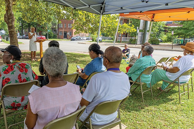 Janice Pankey, president of The Charmettes Inc., speaks at the 52nd anniversary commemorative service.