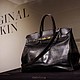 The original Birkin on display in New York in June ahead of the auction sale.
Mandatory Credit:	Brendan McDermid/Reuters via CNN Newsource