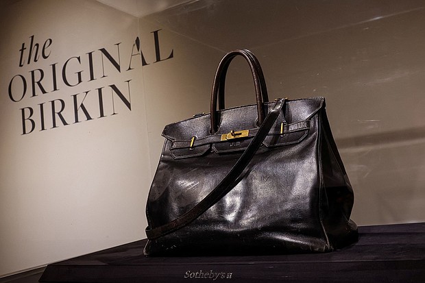 The original Birkin on display in New York in June ahead of the auction sale.
Mandatory Credit:	Brendan McDermid/Reuters via CNN Newsource