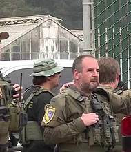 Approximately 70 local, state, and federal agents raided the farm, emptying large containers of marijuana.
Mandatory Credit:	KSBW via CNN Newsource