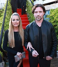 Denise Richards has accused her estranged husband, Aaron Phypers, of “repeatedly” physically abusing her throughout their marriage.
Mandatory Credit:	Arnold Jerocki/Getty Images via CNN Newsource