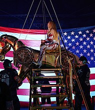 Beyoncé on stage at Mercedes-Benz Stadium in Atlanta, flanked by the American flag.
Mandatory Credit:	Julian Dakdouk/PictureGroup//Shutterstock via CNN Newsource
