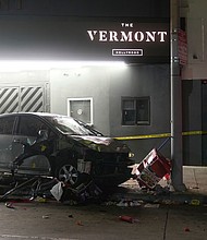 A vehicle sits on the sidewalk after ramming into a crowd of people waiting to enter a nightclub along a busy boulevard in Los Angeles on July 19, injuring several people.
Mandatory Credit:	Damian Dovarganes/AP via CNN Newsource
