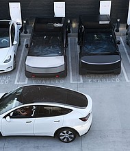 Tesla vehicles at a recently opened Tesla Diner and Drive-In restaurant in Hollywood, California. Tesla is due to report second quarter financial results after the market close on July 23.
Mandatory Credit:	Patrick T. Fallon/AFP/Getty Images via CNN Newsource