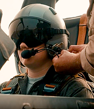 Houston City College Military Air Force ROTC cadets straps into the cockpit of a trainer to take an orientation flight