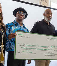 Joi Adams, executive director of Life After Justice, Terence Richardson, Ferrone Claiborne and Life After Justice Co-Founder Jarrett Adams celebrate during a “Celebration of Freedom” brunch Saturday, July 19, when the organization presented the two men with a check.