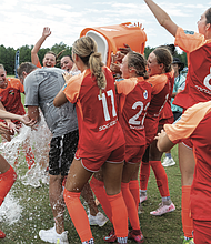 Real Colorado of Denver drenched their coach in celebration.