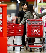 Shoppers look for bargains at a Target in Chicago. The retail is ending its "price match" policy later this month.
Mandatory Credit:	Kamil Krzaczynski/AFP via Getty Images via CNN Newsource