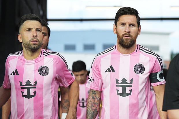 Inter Miami star Lionel Messi (right) and teammate Jordi Alba (left) enter the pitch during an MLS match against FC Cincinnati on July 16.  MLS announced on July 25 that Messi and Alba will be suspended for the team’s next game against FC Cincinnati on Saturday.
Mandatory Credit:	Jeff Dean/Getty Images via CNN Newsource