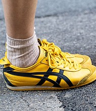 Slim-line styles like the Onitsuka Tiger were once worn exclusively on the race track. Now they're a common sight on the streets.
Mandatory Credit:	Valentina Frugiuele/Getty Images via CNN Newsource