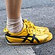 Slim-line styles like the Onitsuka Tiger were once worn exclusively on the race track. Now they're a common sight on the streets.
Mandatory Credit:	Valentina Frugiuele/Getty Images via CNN Newsource
