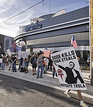 Anti-Tesla and Elon Musk protesters demonstrated out front of the new Tesla Diner and Super Charger venue in Los Angeles, on July 26, 2025.
Mandatory Credit:	Ted Soqui/Sipa USA/AP via CNN Newsource