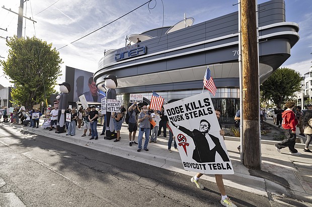 Anti-Tesla and Elon Musk protesters demonstrated out front of the new Tesla Diner and Super Charger venue in Los Angeles, on July 26, 2025.
Mandatory Credit:	Ted Soqui/Sipa USA/AP via CNN Newsource