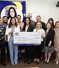 Claudia Márquez, COO, Hyundai Motor America (center) presents faculty and staff of the UC Irvine Paul Merage School of Business with a UCI Foundation donation in Irvine, Calif. on May 9, 2025. (Photo/Hyundai)