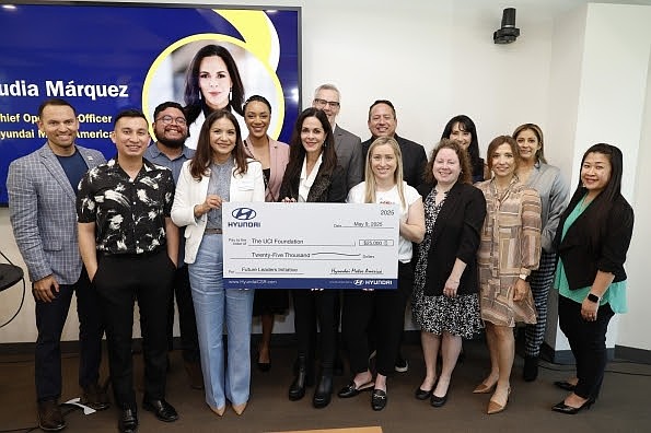 Claudia Márquez, COO, Hyundai Motor America (center) presents faculty and staff of the UC Irvine Paul Merage School of Business with a UCI Foundation donation in Irvine, Calif. on May 9, 2025. (Photo/Hyundai)
