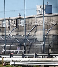 Seen here is the security fencing at Delaney Hall, a 1,000-person detention center operated by private prison company GEO Group for Immigration and Customs Enforcement (ICE), in Newark, New Jersey, on May 10.
Mandatory Credit:	Bing Guan/Reuters via CNN Newsource