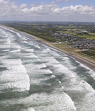 An aerial photo shows white waves crashing onto the Kujukuri Coast in Sosa City, Chiba Prefecture on Wednesday.
Mandatory Credit:	Toshiyuki Kon/The Yomiuri Shimbun/AP via CNN Newsource