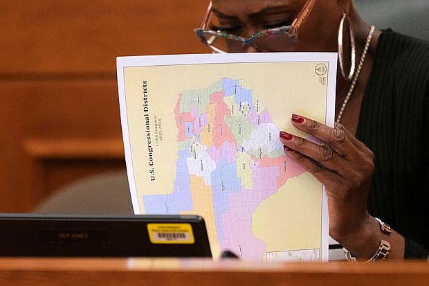 Texas state Rep. Jolanda "Jo" Jones looks through US Congressional District maps during a redistricting hearing at the Texas Capitol on July 24 in Austin, Texas.
Mandatory Credit:	Eric Gay/AP via CNN Newsource