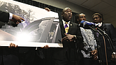 William McNeil Jr.’s attorney Ben Crump, center, speaks while showing a still from a police body cam video during a press conference Tuesday, July 29, 2025, in Chicago.