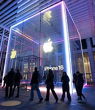 People walk by the Apple Store on Fifth Avenue during sunset in New York City. Apple reported strong iPhone sales and rebound in revenue from China.
Mandatory Credit:	Craig T Fruchtman/Getty Images via CNN Newsource