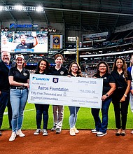 Cooling Communities On-Field Check Presentation - Daikin and Astros Foundation (Photo by Rankin White/Houston Astros)
