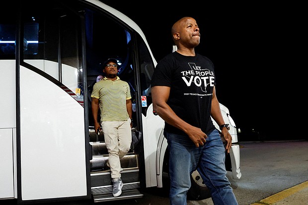 Democratic lawmakers from Texas arrive for a news conference with Illinois Governor J.B. Pritzker, after leaving their state to deny Republicans the quorum needed to redraw the state's 38 congressional districts, in Carol Stream, Illinois, August 3, 2025.
Mandatory Credit:	Kamil Krzaczynski/Reuters via CNN Newsource