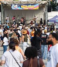 Richmonders gathered in Shockoe Bottom on Saturday, Aug. 2, to celebrate 804 Day. a block party–style festival featuring live music across multiple stages, local vendors, food, drinks and showcases of area nonprofits. In this photo, rock band Bucko performs on the WNRN stage.