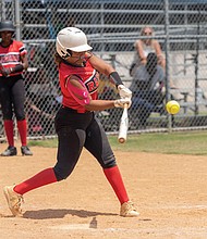 Ta’mya Kiefer (7) of the Rocky Mount Raiders softball team from North Carolina steps up to bat against the USZ Angels in the 18U division of the Metropolitan Junior Baseball League’s 34th annual championships on Sunday, Aug. 3.