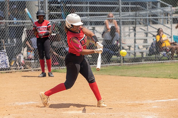 Ta’mya Kiefer (7) of the Rocky Mount Raiders softball team from North Carolina steps up to bat against the USZ Angels in the 18U division of the Metropolitan Junior Baseball League’s 34th annual championships on Sunday, Aug. 3.