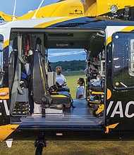Ron Wright and his 8-year-old daughter, Jordan, learn about VCU’s LifeEvac helicopter and emergency response operations.