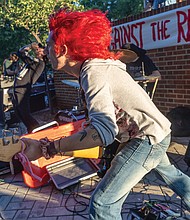 Brick, bassist for the band Lay Waste, performs during the event.