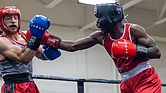 Kamaal Brown, fighting out of the red corner, faces Elliot Axeiman in bout five of the elite male division during the 5th Annual Gloves Over Guns boxing match at Varina High School on Saturday, Aug. 2.