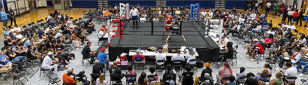 Noah Ricketts, in the blue corner, takes on Alan Reyes in bout eight of the junior male division.
