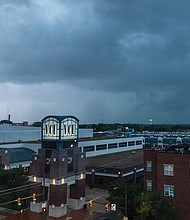 Lightning struck the northside neighborhoods of Richmond, visible from the corner of Broad
and Harrison Street on Saturday, July 19. The days ahead are expected to be hot and humid,
with sunshine on Thursday followed by a chance of afternoon thunderstorms Friday and into
the weekend.