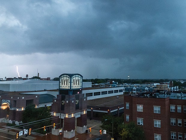 Lightning struck the northside neighborhoods of Richmond, visible from the corner of Broad
and Harrison Street on Saturday, July 19. The days ahead are expected to be hot and humid,
with sunshine on Thursday followed by a chance of afternoon thunderstorms Friday and into
the weekend.