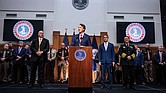 Gov. Glenn Youngkin, flanked by then-House Minority Leader Todd Gilbert, R-Shenandoah (left), and Attorney General Jason Miyares, speaks at a press conference on Thursday, Dec. 12, 2024, at the Patrick Henry Building in Richmond.