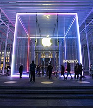 People walk by the Apple Store on Fifth Avenue on February 24 in New York City. Apple is investing another $100 billion to expand its operations in the United States, President Donald Trump will announce later August 6, a White House official said.
Mandatory Credit:	Craig T Fruchtman/Getty Images via CNN Newsource