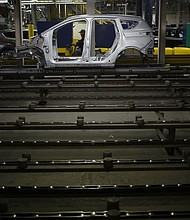 The metal frame of a Ford Escape SUV on the production line at the Ford Louisville Assembly plant in Kentucky. Ford will stop producing the Escape in Louisville, building a new type of assembly line for its next generation of electric vehicles.
Mandatory Credit:	Luke Sharrett/Bloomberg/Getty Images via CNN Newsource