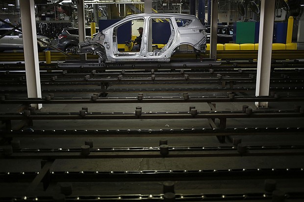 The metal frame of a Ford Escape SUV on the production line at the Ford Louisville Assembly plant in Kentucky. Ford will stop producing the Escape in Louisville, building a new type of assembly line for its next generation of electric vehicles.
Mandatory Credit:	Luke Sharrett/Bloomberg/Getty Images via CNN Newsource