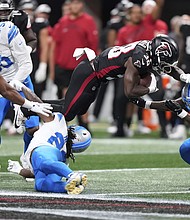 Detroit Lions safety Morice Norris  is hit in the helmet by Atlanta Falcons running back Nathan Carter (38) during the second half of an NFL preseason football game Friday.
Mandatory Credit:	Brynn Anderson/AP via CNN Newsource