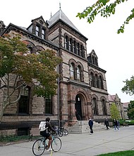 People traverse Brown University campus in Providence, Rhode Island, on October 12, 2020.
Mandatory Credit:	Steven Senne/AP via CNN Newsource
