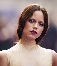 A poster girl for the "Tired Girl" makeup trend, Jenna Ortega is pictured at the season two premiere of the TV series "Wednesday" in London.
Mandatory Credit:	Scott A Garfitt/Invision/AP via CNN Newsource