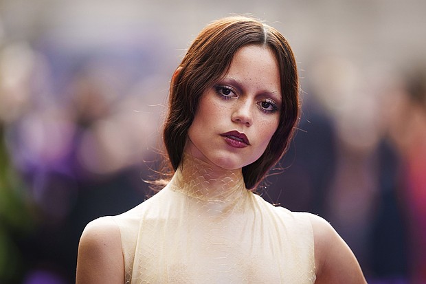 A poster girl for the "Tired Girl" makeup trend, Jenna Ortega is pictured at the season two premiere of the TV series "Wednesday" in London.
Mandatory Credit:	Scott A Garfitt/Invision/AP via CNN Newsource