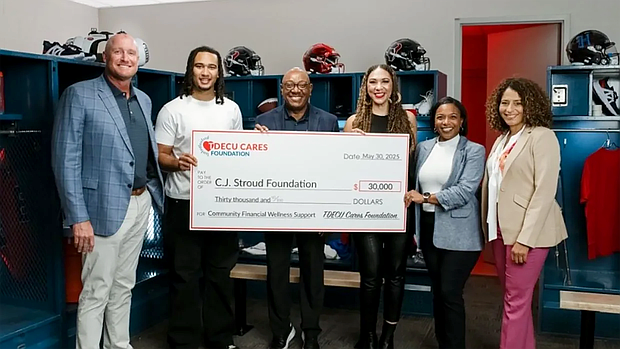 Pictured (L to R): TDECU Chief Growth Officer Josh Brian, Houston Texans quarterback C.J. Stroud, TDECU President and CEO Isaac Johnson, C.J. Stroud Foundation President Kimberly Stroud, TDECU VP – Executive Director of the TDECU Cares Foundation Crystal Harris, and TDECU SVP – Marketing and Brand Laura Whitley. (Photo Courtesy: TDECU / TDECU)