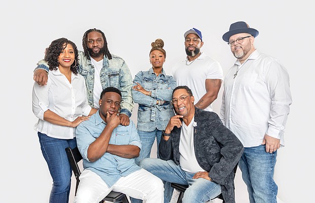 Cast members of the stage play “Father Figure” gather ahead of its Aug. 23 performance
at St. Paul’s Baptist Church North in Richmond. The playwright, Garrett Davis, is seated
at right.
