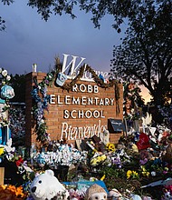 A memorial honors the 21 victims gunned down at Robb Elementary School in 2022.
Mandatory Credit:	Jordan Vonderhaar/Getty Images via CNN Newsource