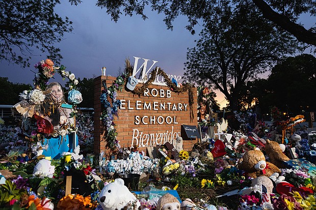 A memorial honors the 21 victims gunned down at Robb Elementary School in 2022.
Mandatory Credit:	Jordan Vonderhaar/Getty Images via CNN Newsource