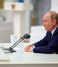 Russian President Vladimir Putin chairs a meeting of Russia's top leadership at the Kremlin in Moscow on August 14.
Mandatory Credit:	Kremlin via CNN Newsource