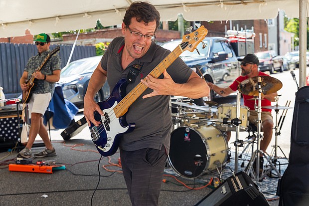 Run the Ride performs the noon set on the Melon Stage at the 43rd Annual Carytown Watermelon Festival in Carytown on Sunday Aug 10. The event filled Cary Street with more than 100 vendors and artisans selling everything from crafts and teas to food, cups of fresh watermelon, and watermelon-flavored treats and drinks. The event featured live music across five stages, with additional small entertainment acts scattered throughout the street. Activities for all ages included face painting, a children’s area, and carnival rides.